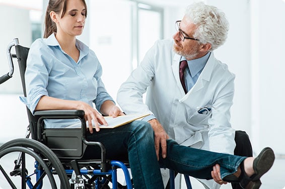 wheelchair user consulting with doctor
