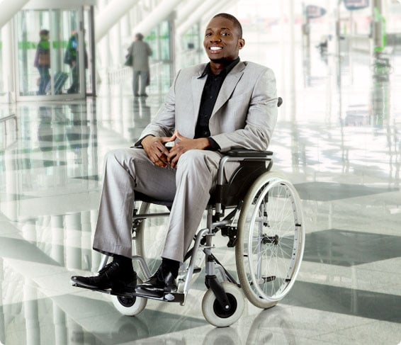 man sitting on wheelchair with cushion